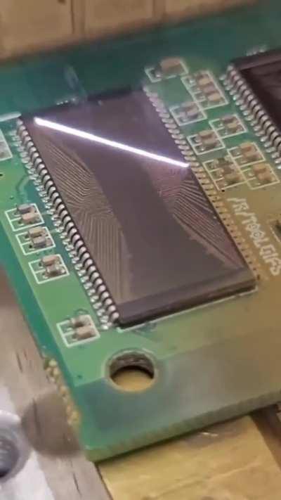 Laser decapping (decapsulation) of an integrated circuit