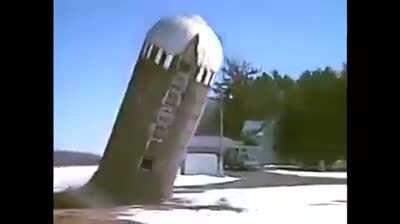 Concrete silo collapsing during demolition