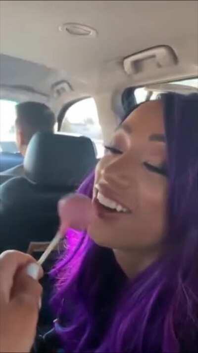 Sasha playing with Bayley's lollipop