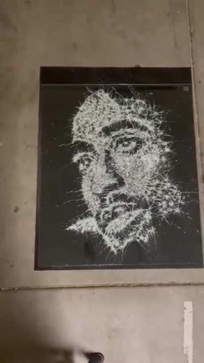 A Tupac Shakur broken glass portrait.