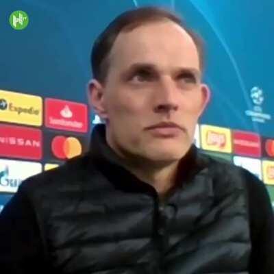 Tuchel mugs to the camera after listening to his own translation!