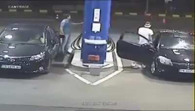 Gas station worker puts out the cigarette as a precaution