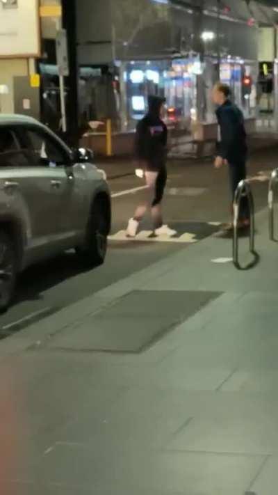 Man walks in the middle of the road