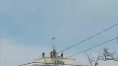 The Russian army raising the Russian flag on Kakhovka hydroelectric power plant