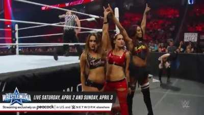 team bellas poses over Becky Lynch