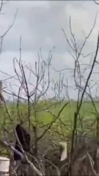 A Ukrainian 36D6 radar system is getting attacked by Iranian Shahed drones. Ukrainian soldiers opened fire on the drones with small arms. Both miss the radar and explode close to the system.