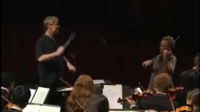 Orchestra plays Happy Birthday for the conductor.