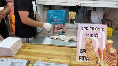 Chips on stick. Great food street idea. In the Carmel market, in Te Aviv.