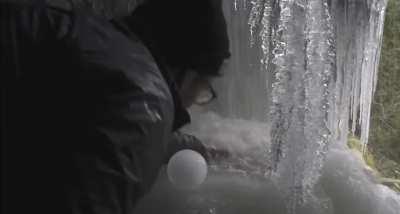 An explorer found an waterfall while hiking in Canada that was making perfect ice-balls.