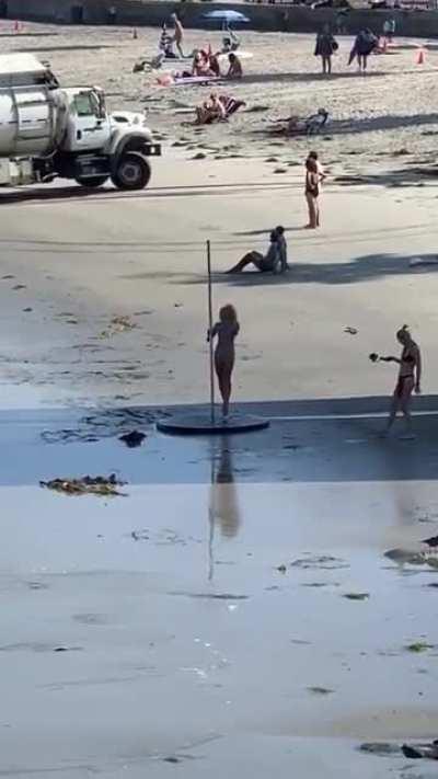 Garbage truck? Check. Low tide? Check. Pole? Check. Glass heels? Check.