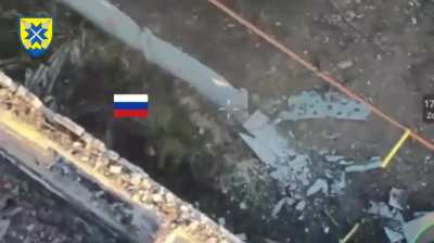 Ukrainian soldier throws grenade on top of two Russian soldiers