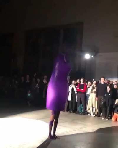 This ballon that becomes a dress at a fashion show.