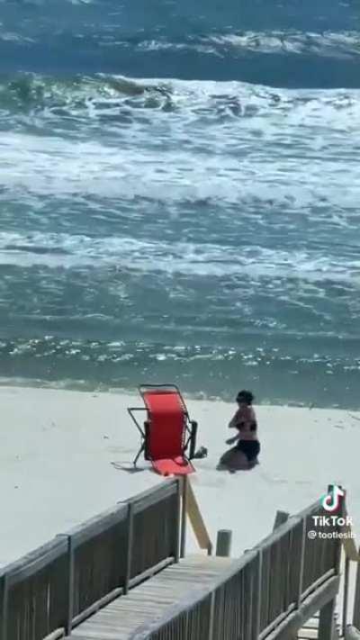 Lady is heels over head for this beach chair