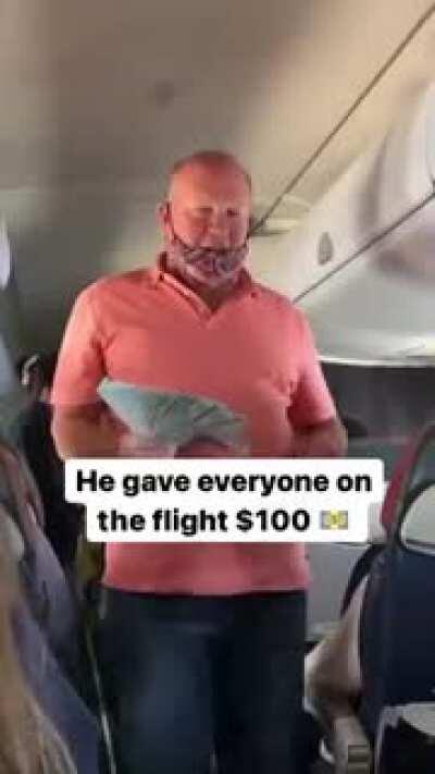 this man is giving out 100 dollars on the flight