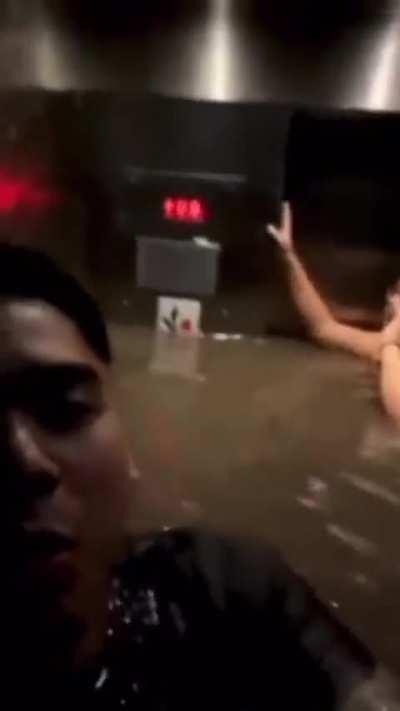 Taking elevator to see flooded basement 