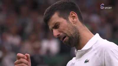 Novak shows the Wimbledon crowd how he's feeling about their boos.