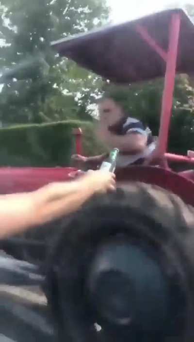 Just some dudes offering a cold one to a farmer on a hot day