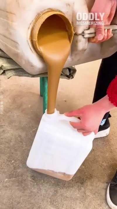 The way she pours this sauce into a bottle