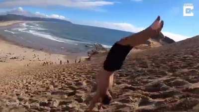 Backflipping down giant sand dune