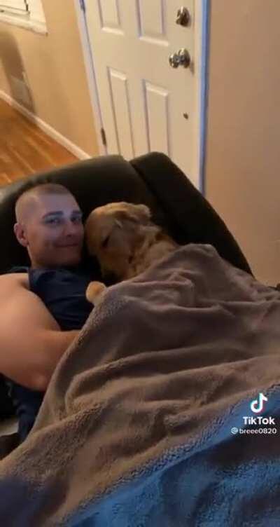 How this dog cuddles with his owner