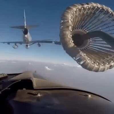 A jet being refueled in mid air