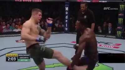 Marvin Vettori gets hit with an elbow from Israel Adesanya but is absolutely certain that it's an eye poke. He then hits the double middle finger into left hand combo