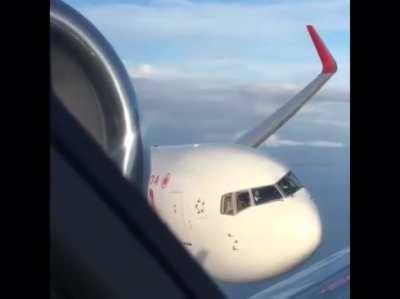 Massive plane comes eerily close to another plane