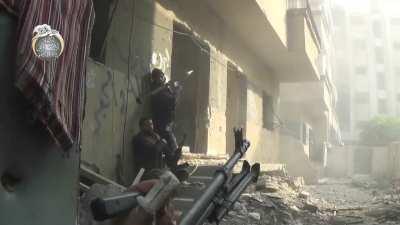 FSA fighters using an RPG at point-blank range while rooting out SAA holdouts - Daraya - 12/10/2014