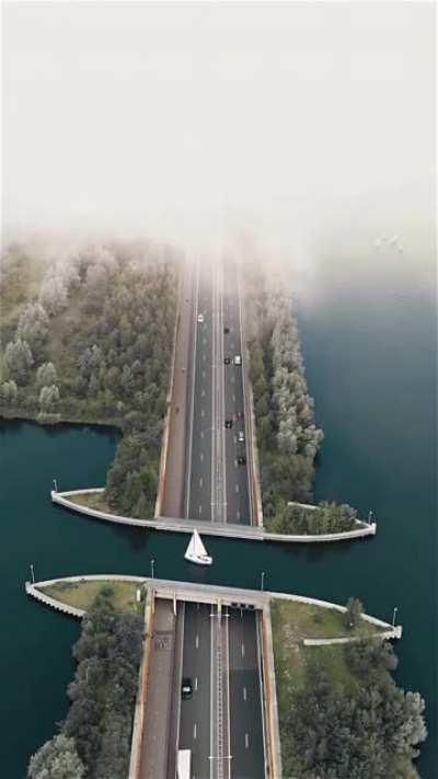 In Netherlands there is a unique 'reverse bridge' (Veluwemeer Aquedict)