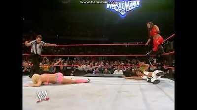 Candice Michelle accidentally low blowed by her tag team partner, Victoria