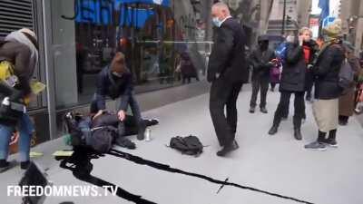 Environmental protestor falls from NY building he was climbing. A can of black paint in his backpack explodes upon impact, polluting the sidewalk and gutter. (He survived)