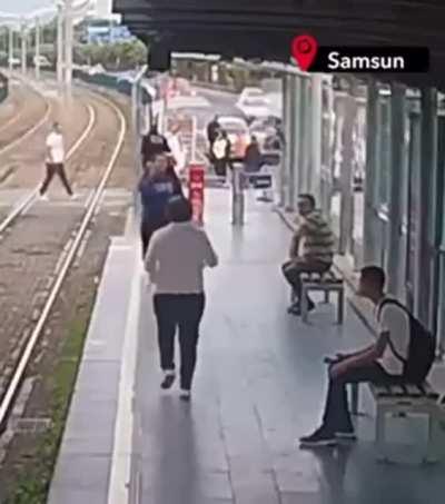 Lucky escape for commuter crossing train tracks . Samsun/Türkiye