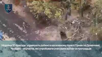 Three russians running into the gunfire of the 35th Marine Brigade