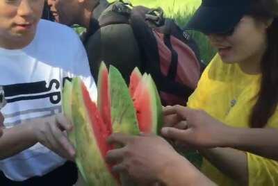 Mongolian way of cutting watermelon