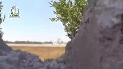 Syrian rebel shoots an SAA bmp with a rocket launcher, and the crew bails out.