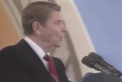 President Ronald Reagan reacting to a balloon popping during his speech in 1987.