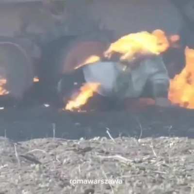 Ukrainian drone captures close video of Russian invader burning alive after his AFV is hit.