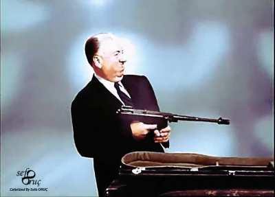 Alfred Hitchcock with a Submachine Gun (1956)