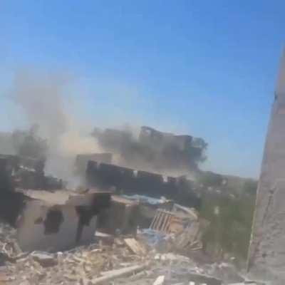 Turkish soldiers firing rpg to enemy gunner position in the building