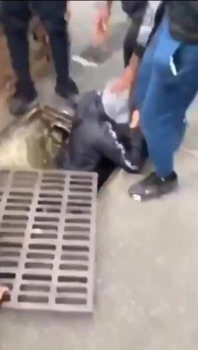 French guy gets thrown into a sewer by some youths