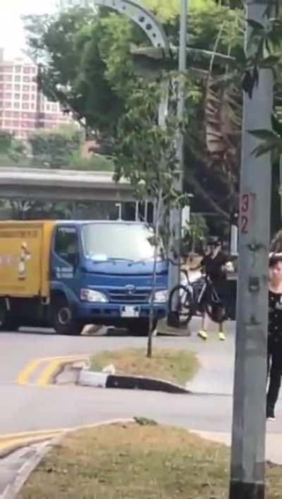 Truck driver tries to run over cyclist and soon realizes he chose the wrong guy to f with