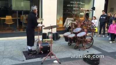 Street Performer Juggles Sticks While Playing The Drums