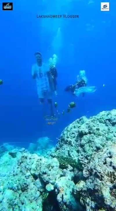 Argentina fans from Kavaratti, a small island in South India, place Messi's figure among coral reefs.