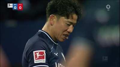 Fans of Union Berlin throwing chocolate coins on the pitch at Bochum to protest against Bundesliga investor plans – Takuma Asano eats it