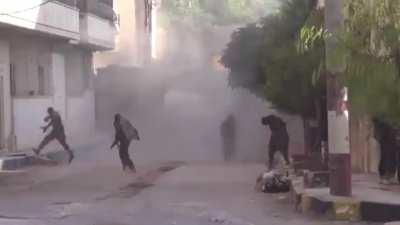 FSA rebels are hit with grenade launchers while trying to recover a wounded/dead fighter (Syria)