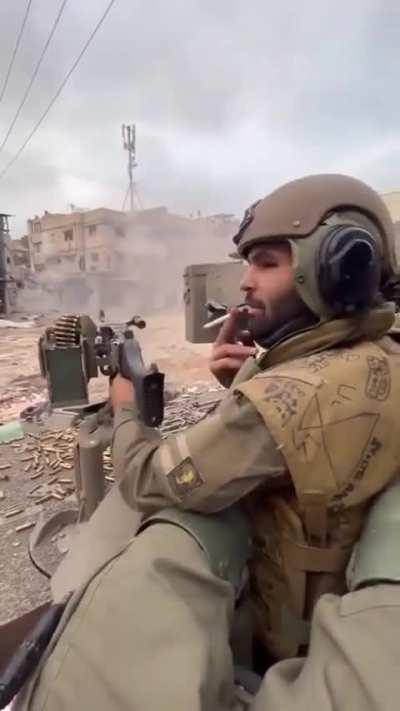 israeli soldier shooting a building