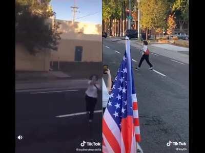 Girl rips Trump flag off truck, with different camera angle