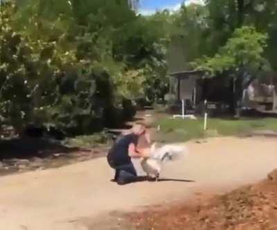 Just a woman being welcomed home by her pet Goose.