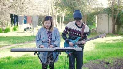 My wife and I playing &quot;Luv (sic) Part 6&quot; in our backyard in Aussie suburbia. Sorry about the washing on the line