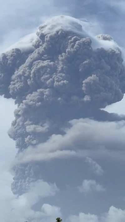 The ashes from La Soufrière volcano burst into the sky so high that it pushes the clouds aside